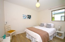 The fourth bedroom also offers a queen bed with pillow top mattress, and is spacious and full of light